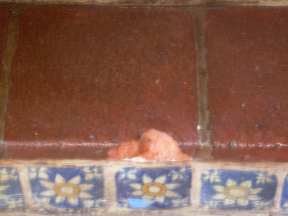 Damaged spanish tile step.